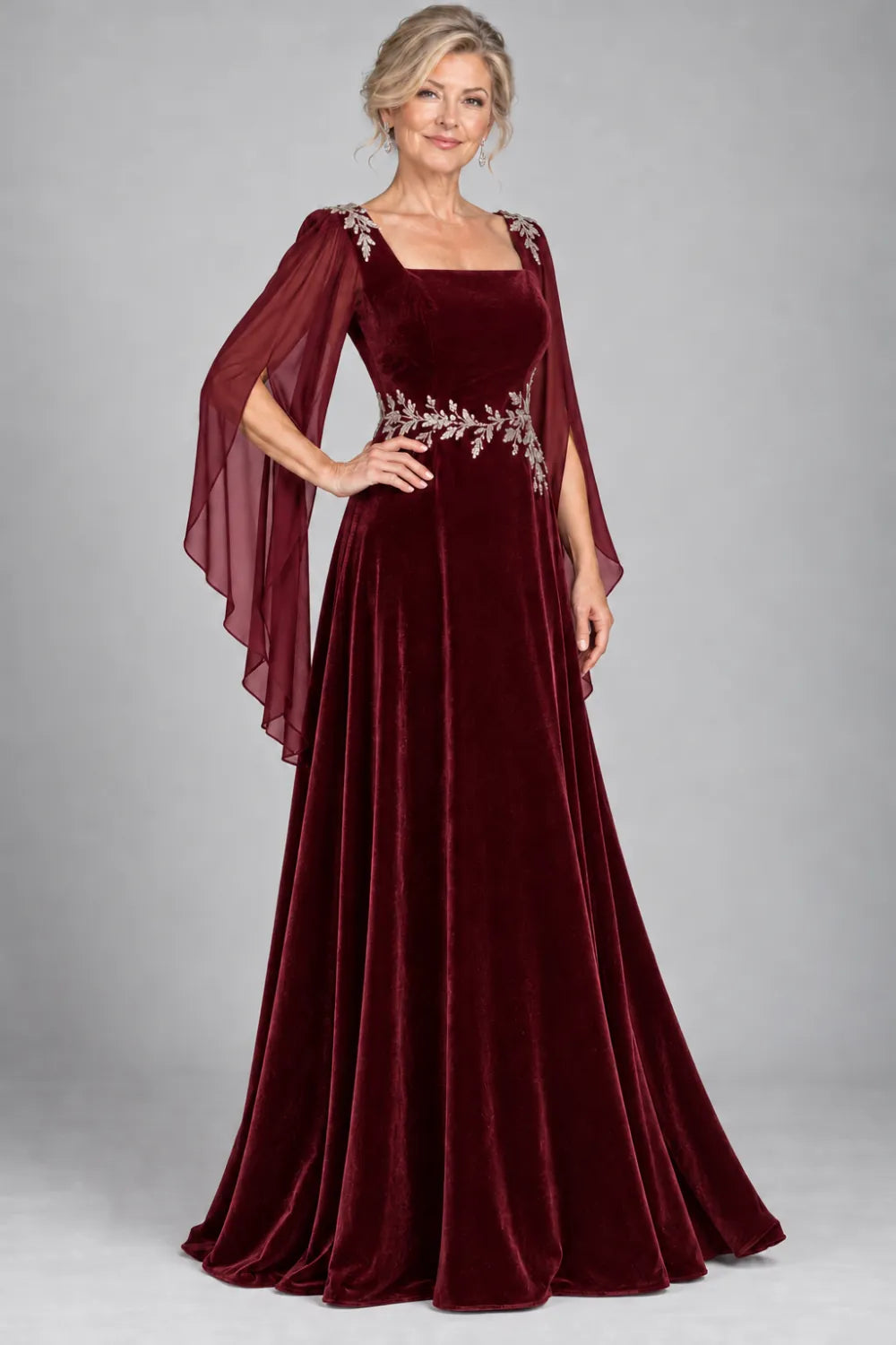 Burgundy dress with silver-tone leafy waist and shoulder accents, front view.