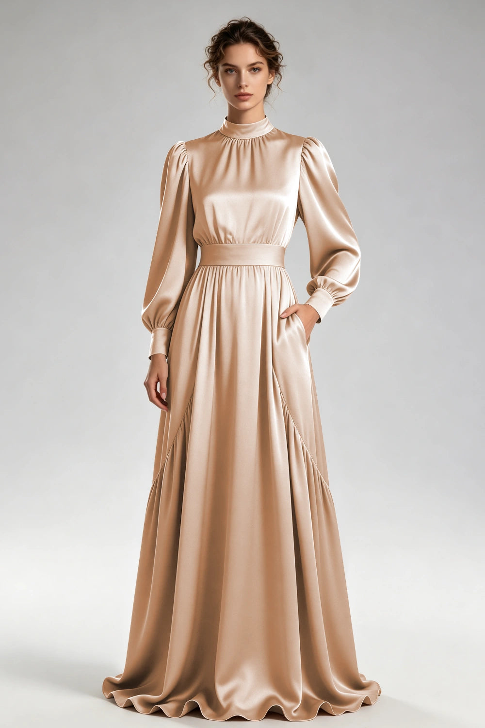 Front view of the champagne high-neck gown with bishop sleeves and a wide waistband.