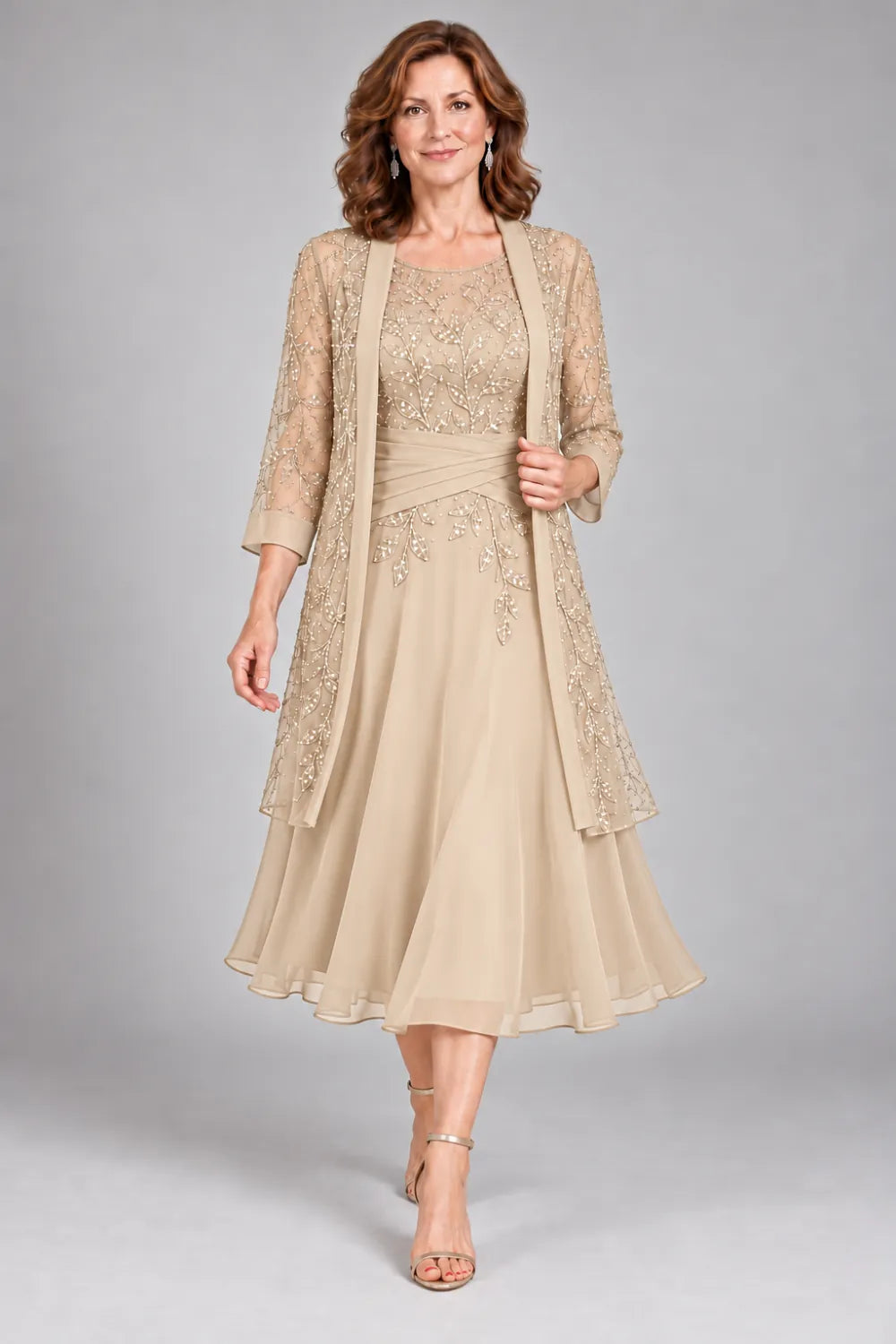 Champagne dress with floral lace extending below the waist, front view.