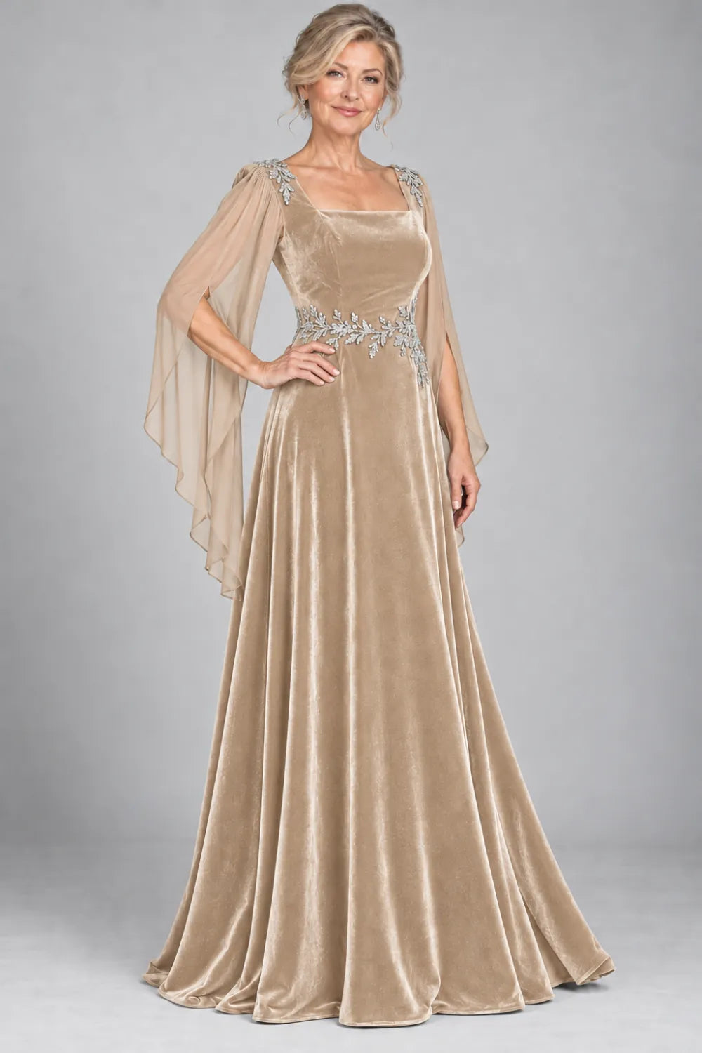 Champagne dress with silver-tone leafy waist and shoulder accents, front view.