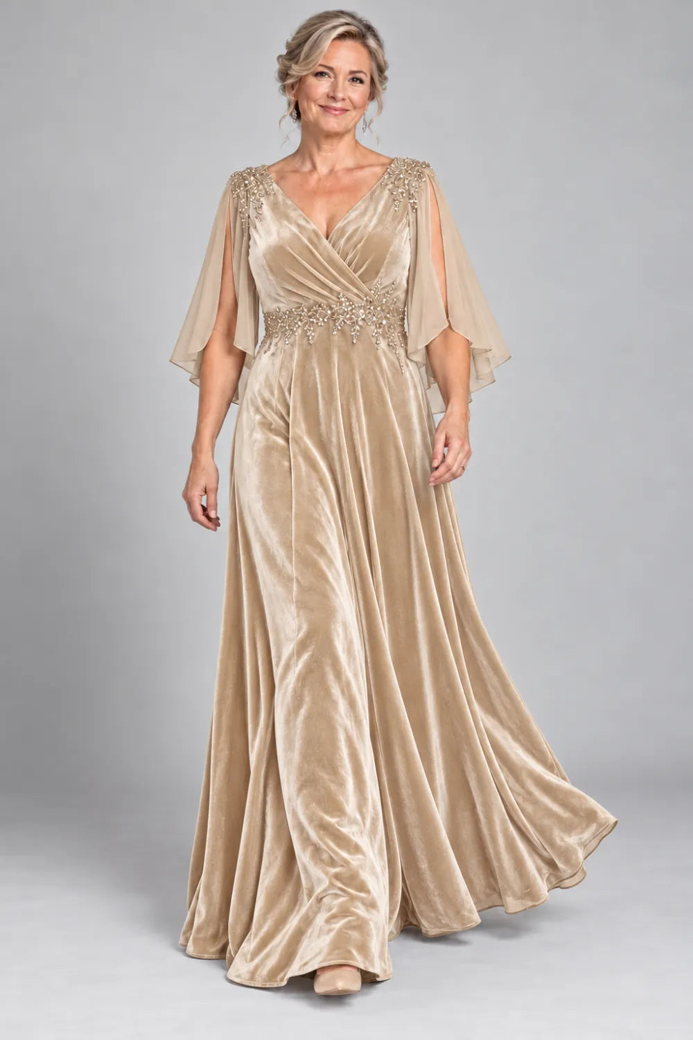 Champagne dress with crossover bodice and decorated waist, front view.