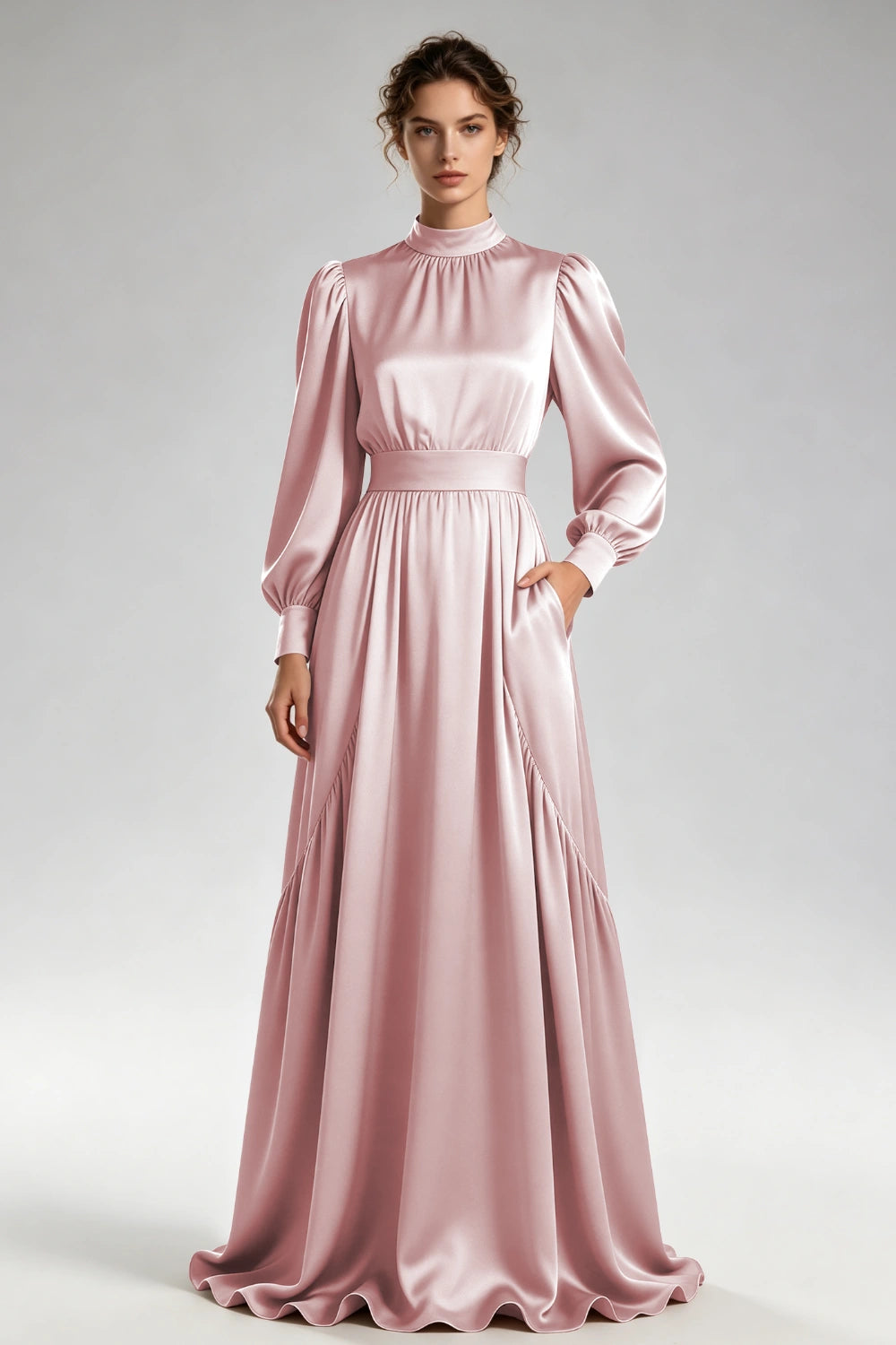 Front view of the dusty rose high-neck gown with bishop sleeves and a wide waistband.