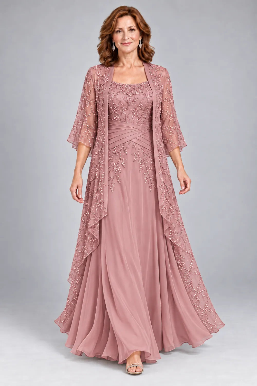Dusty Rose dress with lace bodice, diagonal waist gathers and cascading skirt panel, front view.