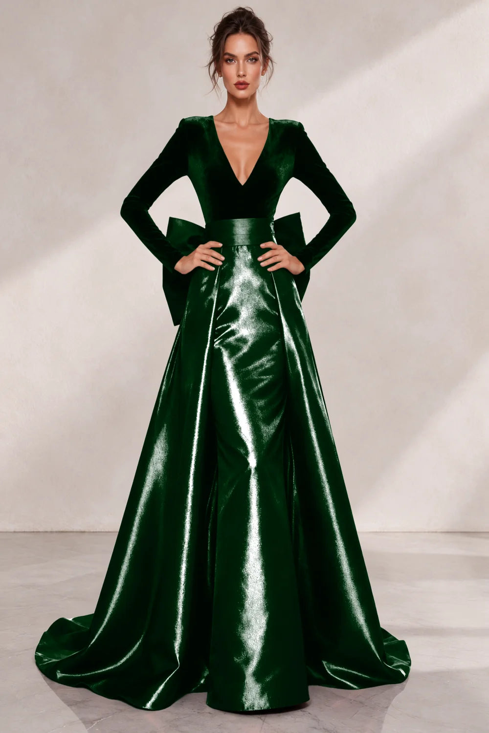 Front view of a emerald green dress with a V neckline and a lustrous full skirt.