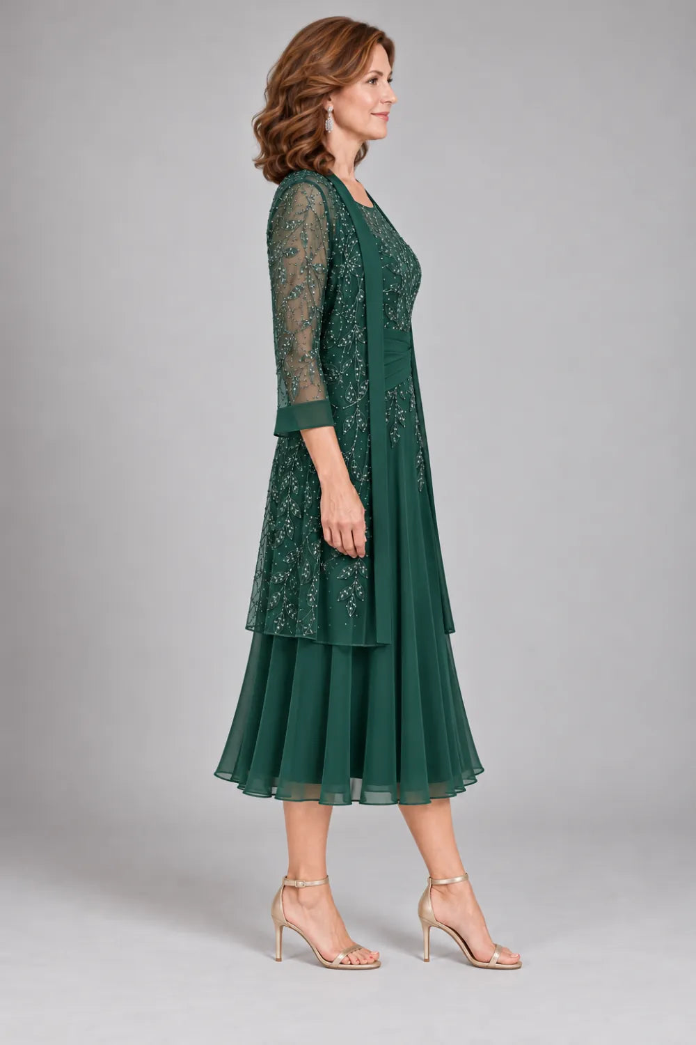 Emerald Green dress with floral lace extending below the waist, side view.
