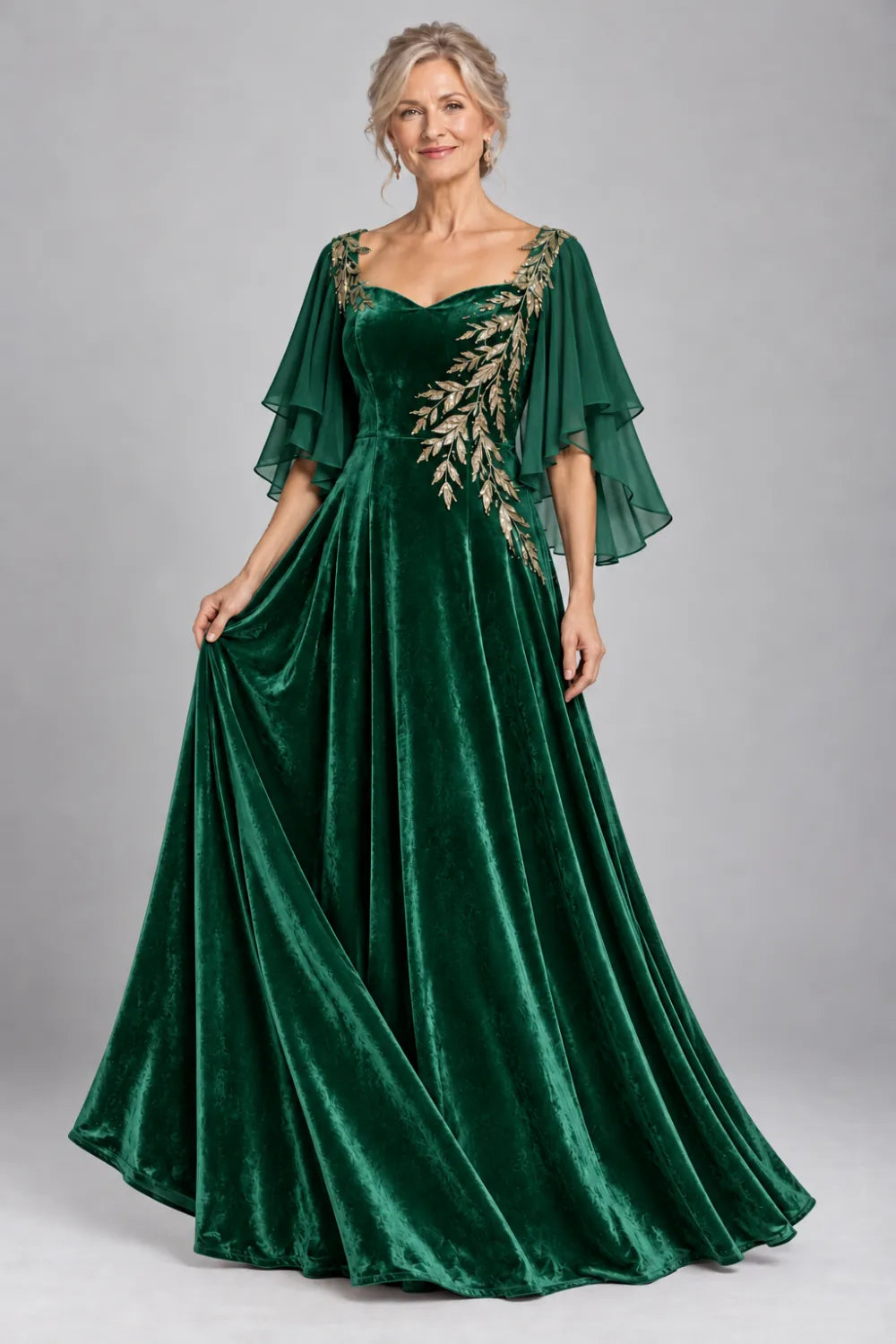 Emerald Green dress with diagonal gold-tone leaf embroidery, front view.