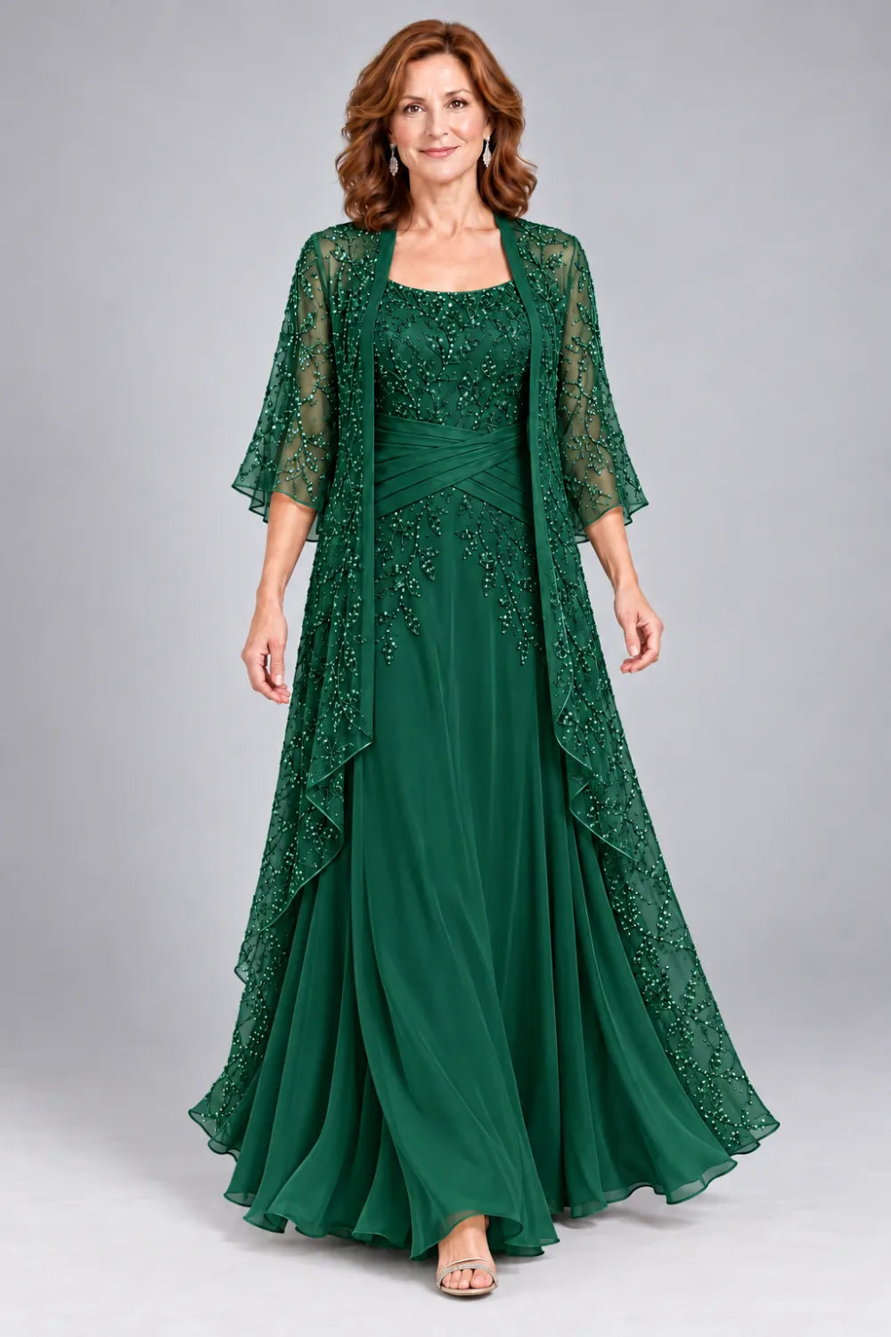 Emerald Green dress with lace bodice, diagonal waist gathers and cascading skirt panel, front view.