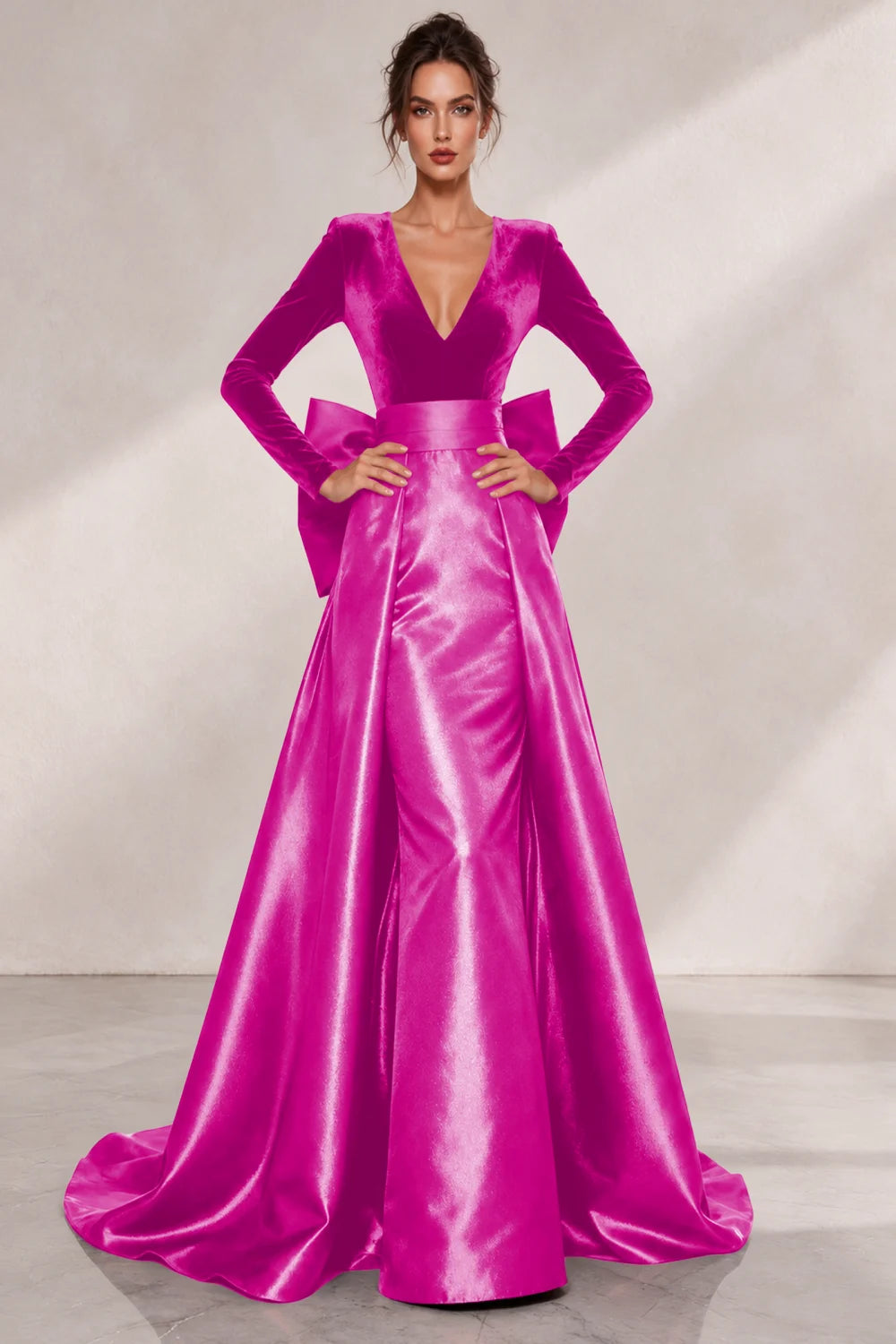Front view of a hot pink dress with a V neckline and a lustrous full skirt.