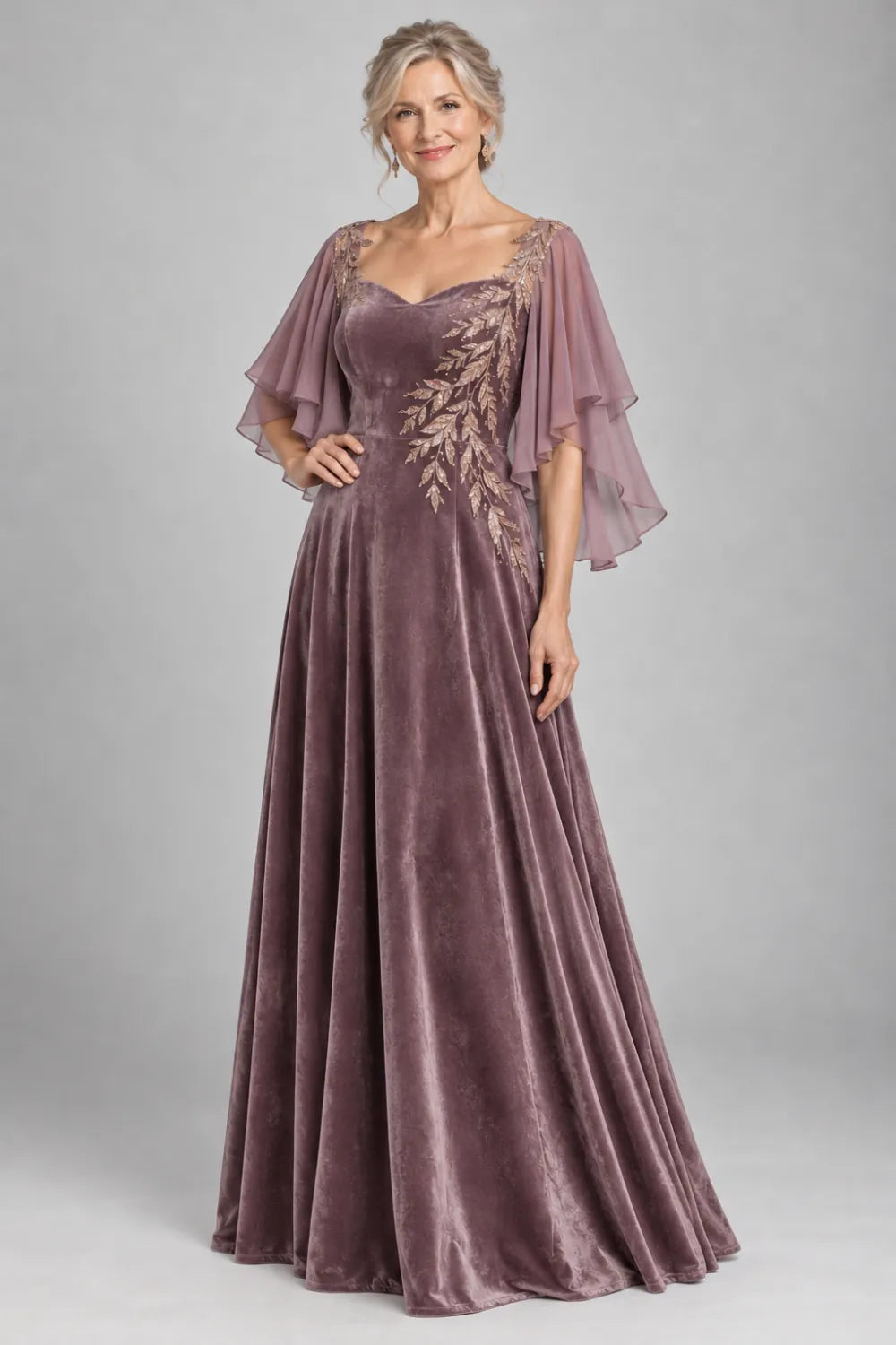 Mauve dress with diagonal gold-tone leaf embroidery, front view.