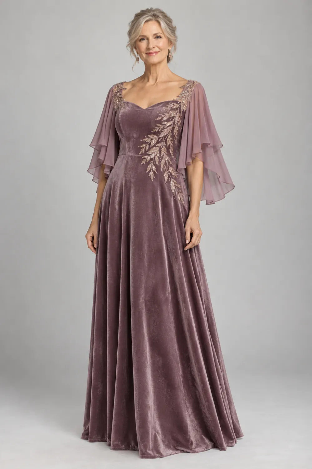 Mauve dress with diagonal gold-tone leaf embroidery, front view.