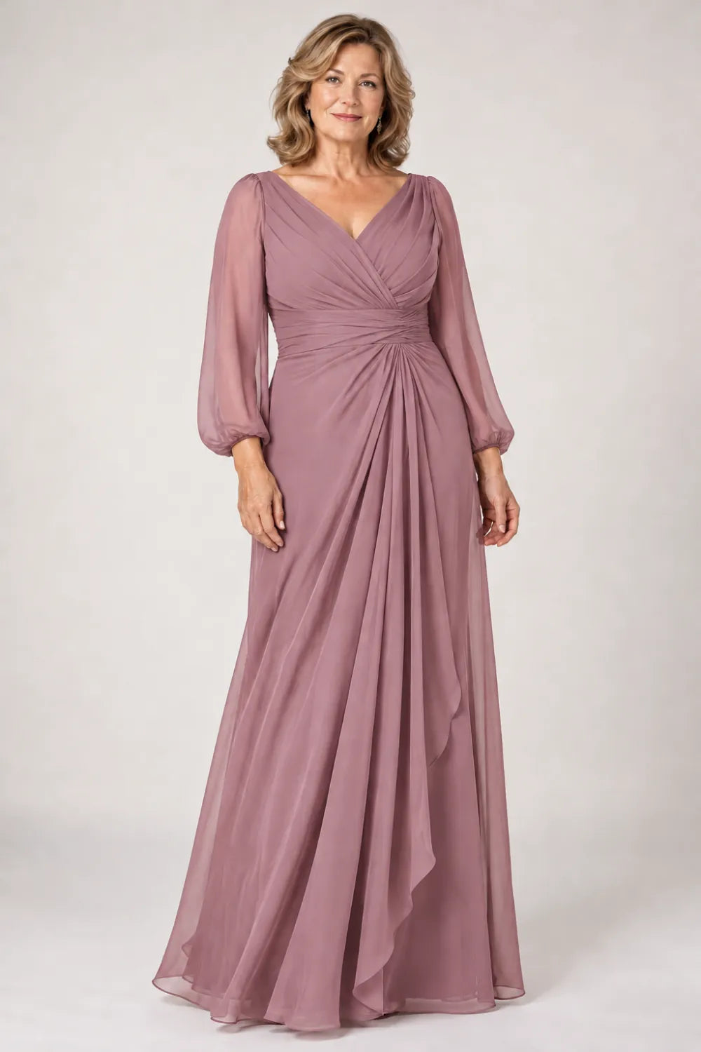 Mauve dress with crossover bodice, gathered waist and cascading side panel, front view.