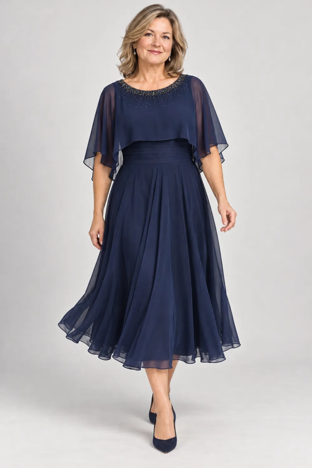 Navy Blue dress with narrow beaded neckline and defined waist, posed front view.