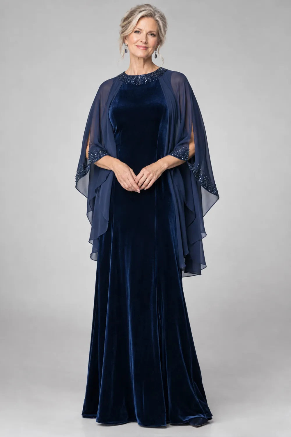 Navy Blue dress with beaded round neckline and cascading sheer cape, front view.