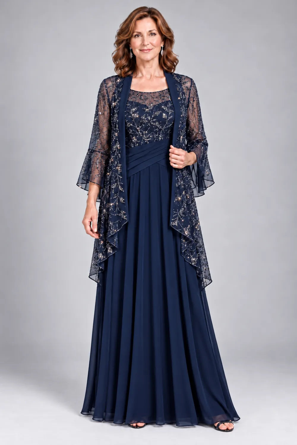 Navy Blue dress with floral decorated bodice and diagonal gathered waist, front view.