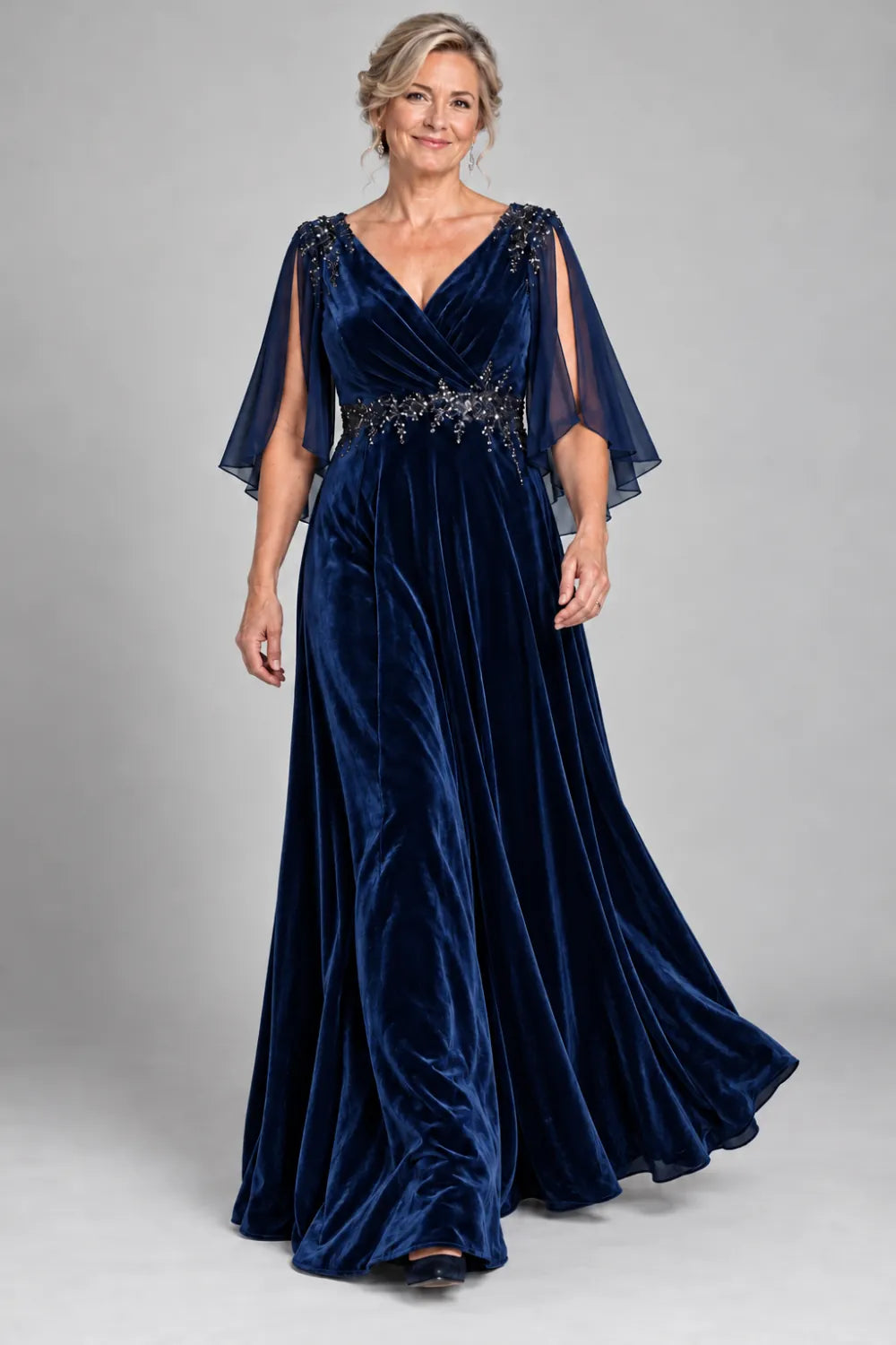 Navy Blue dress with crossover bodice and decorated waist, front view.