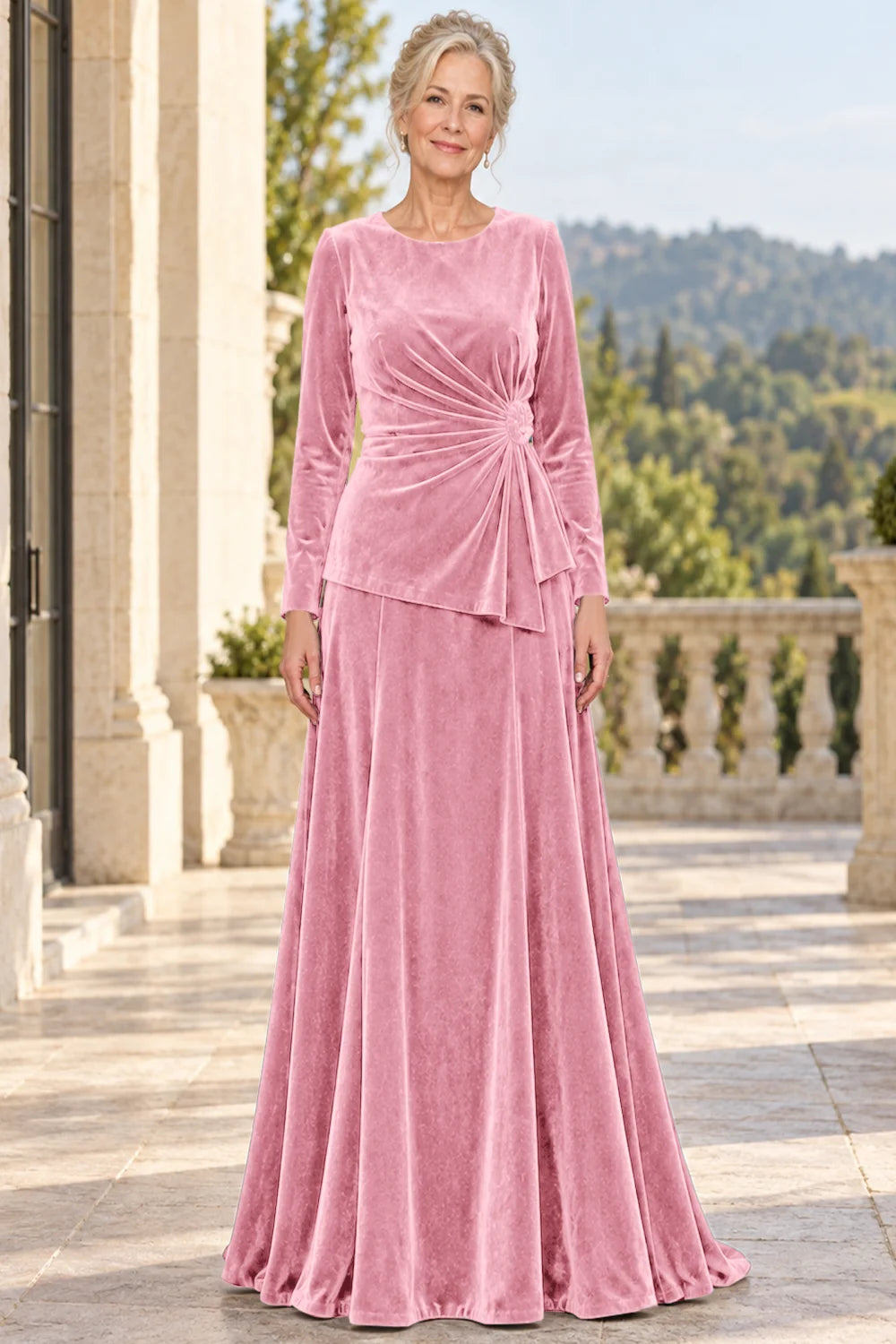 Front view of a pink dress with a ruched front and side rosette.