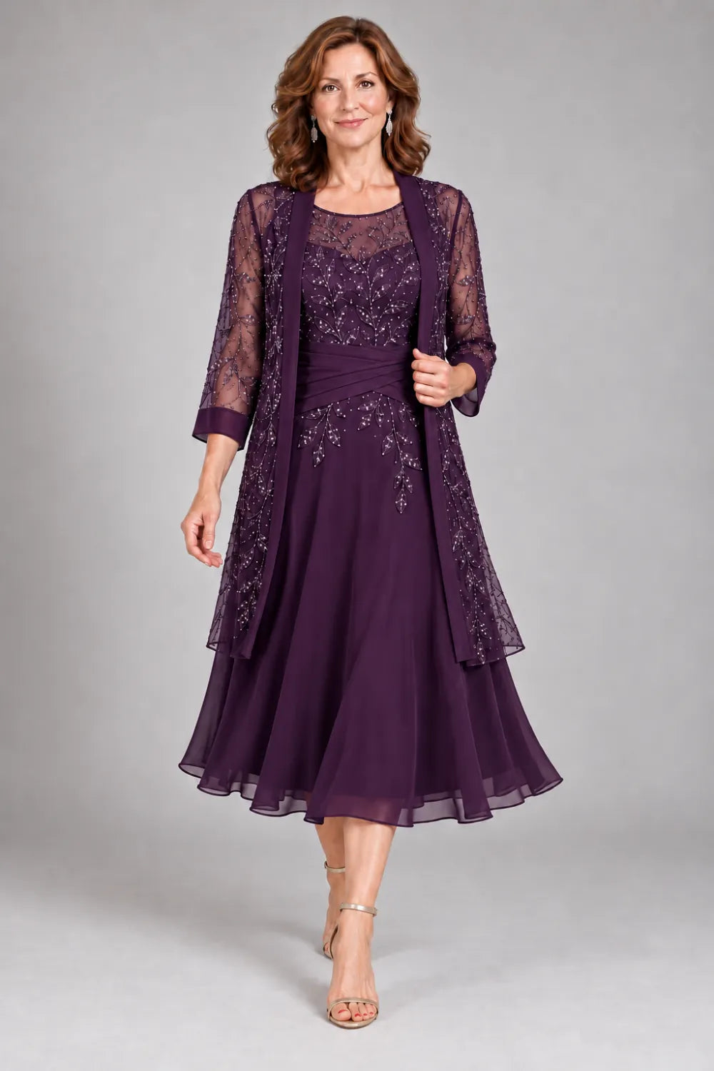 Plum dress with floral lace extending below the waist, front view.