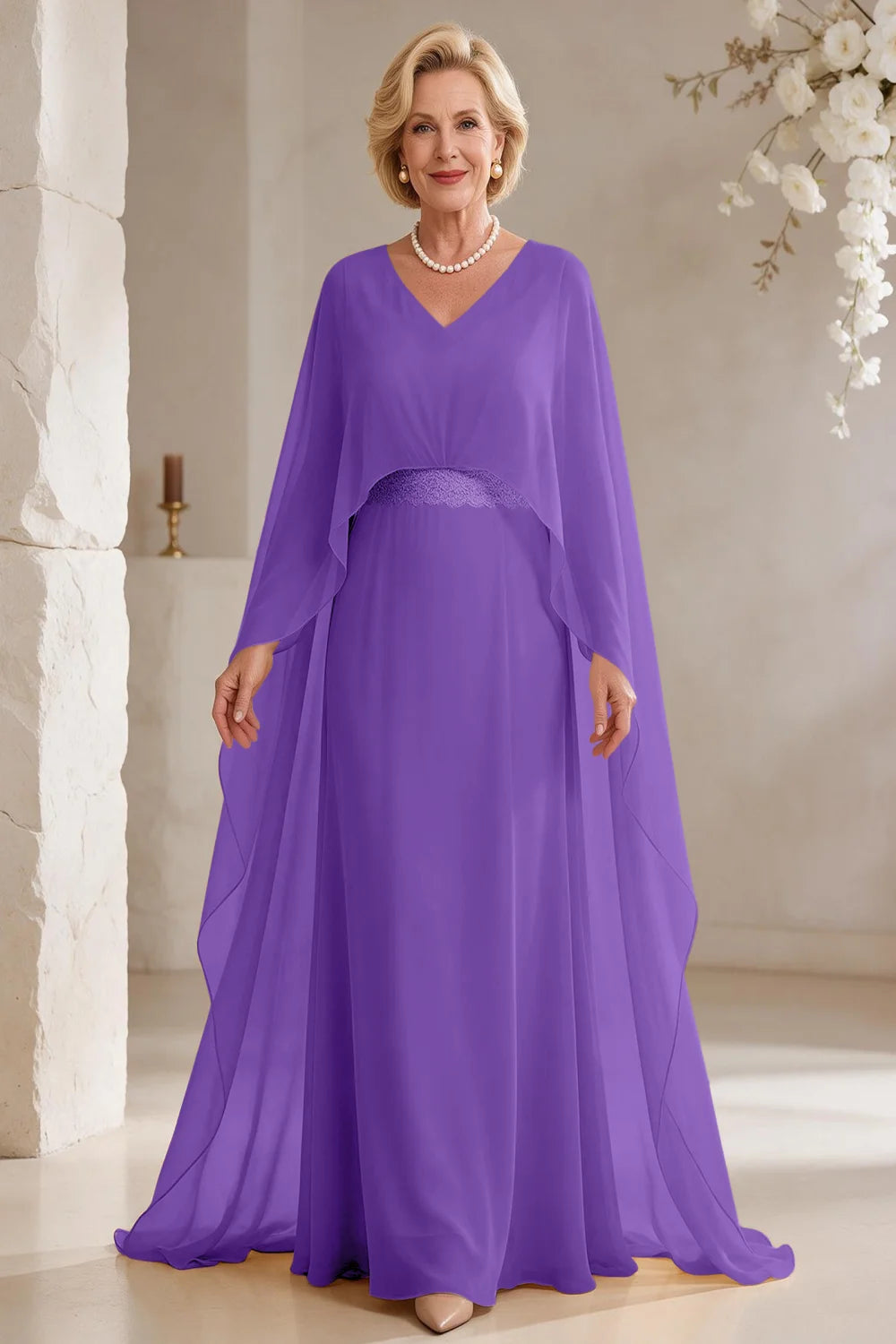 Front view of a purple dress with long cape panels and a flared skirt.