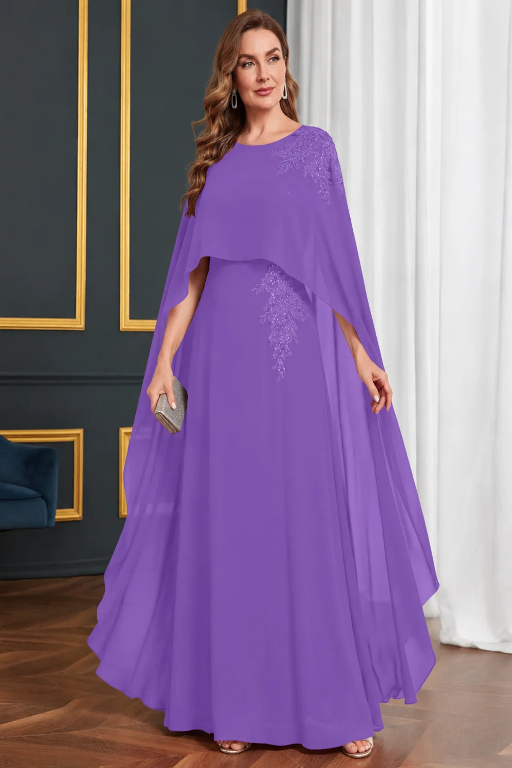 Front view of a purple dress with long cape panels and shoulder decoration.