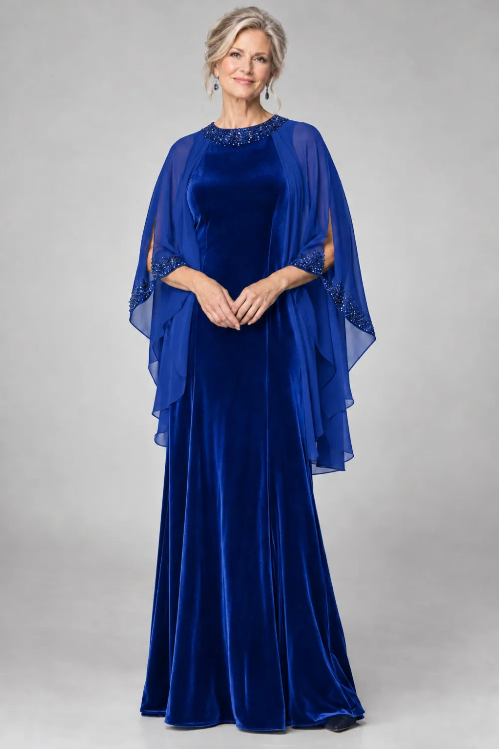 Royal Blue dress with beaded round neckline and cascading sheer cape, front view.