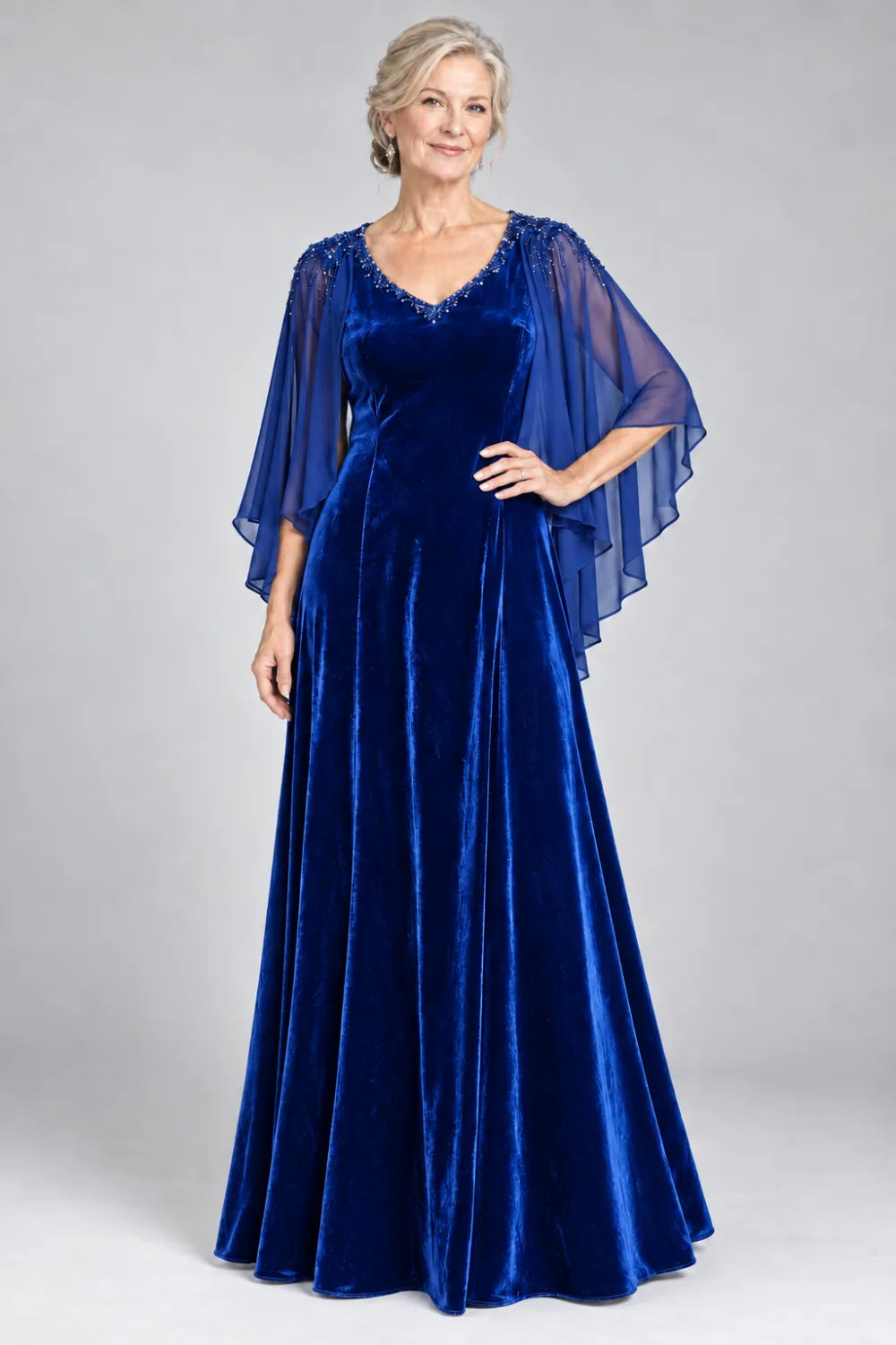 Royal Blue dress with beaded v-neck and layered cascading cape, front view.