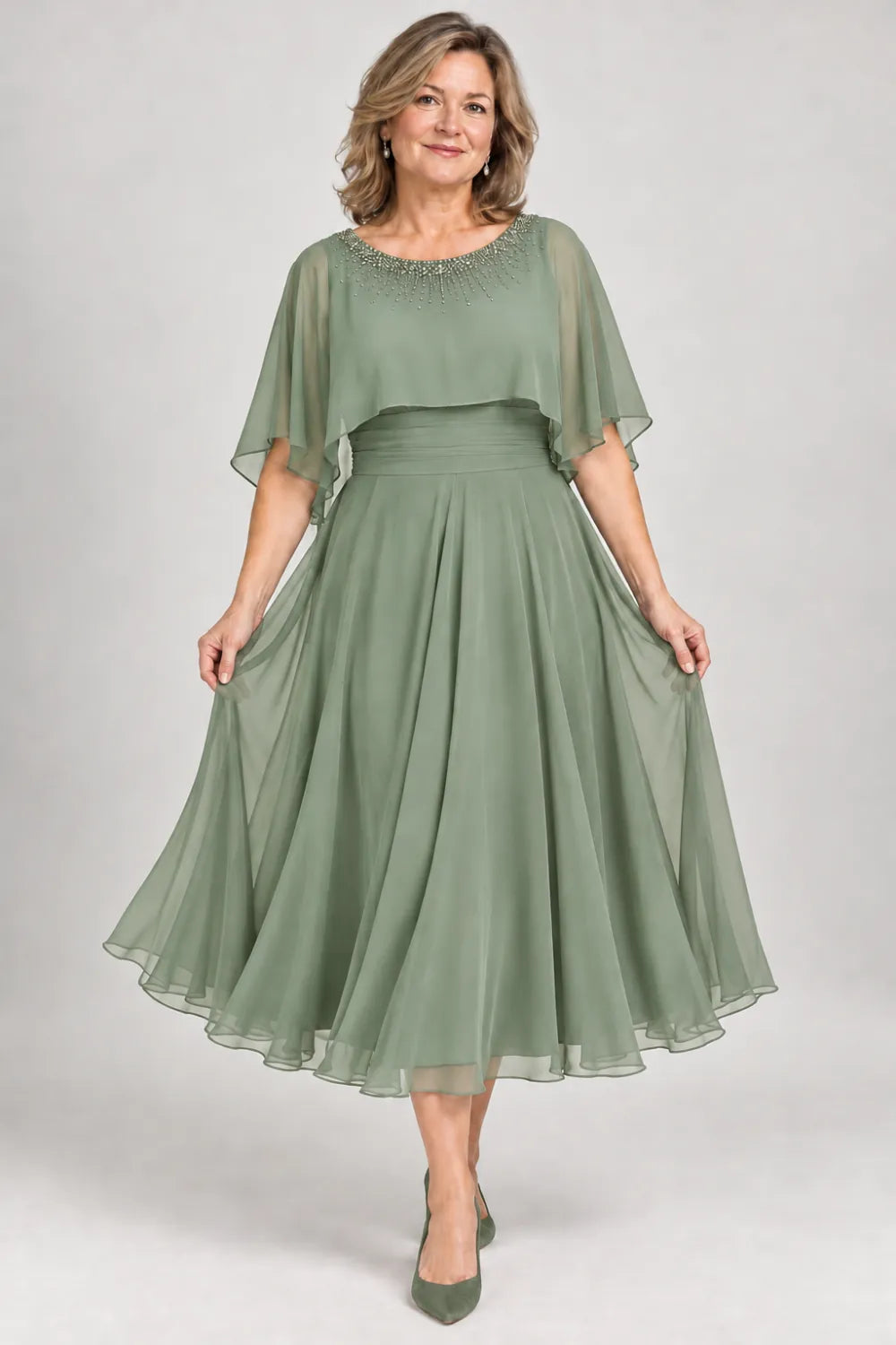 Sage Green dress with narrow beaded neckline and defined waist, front view.