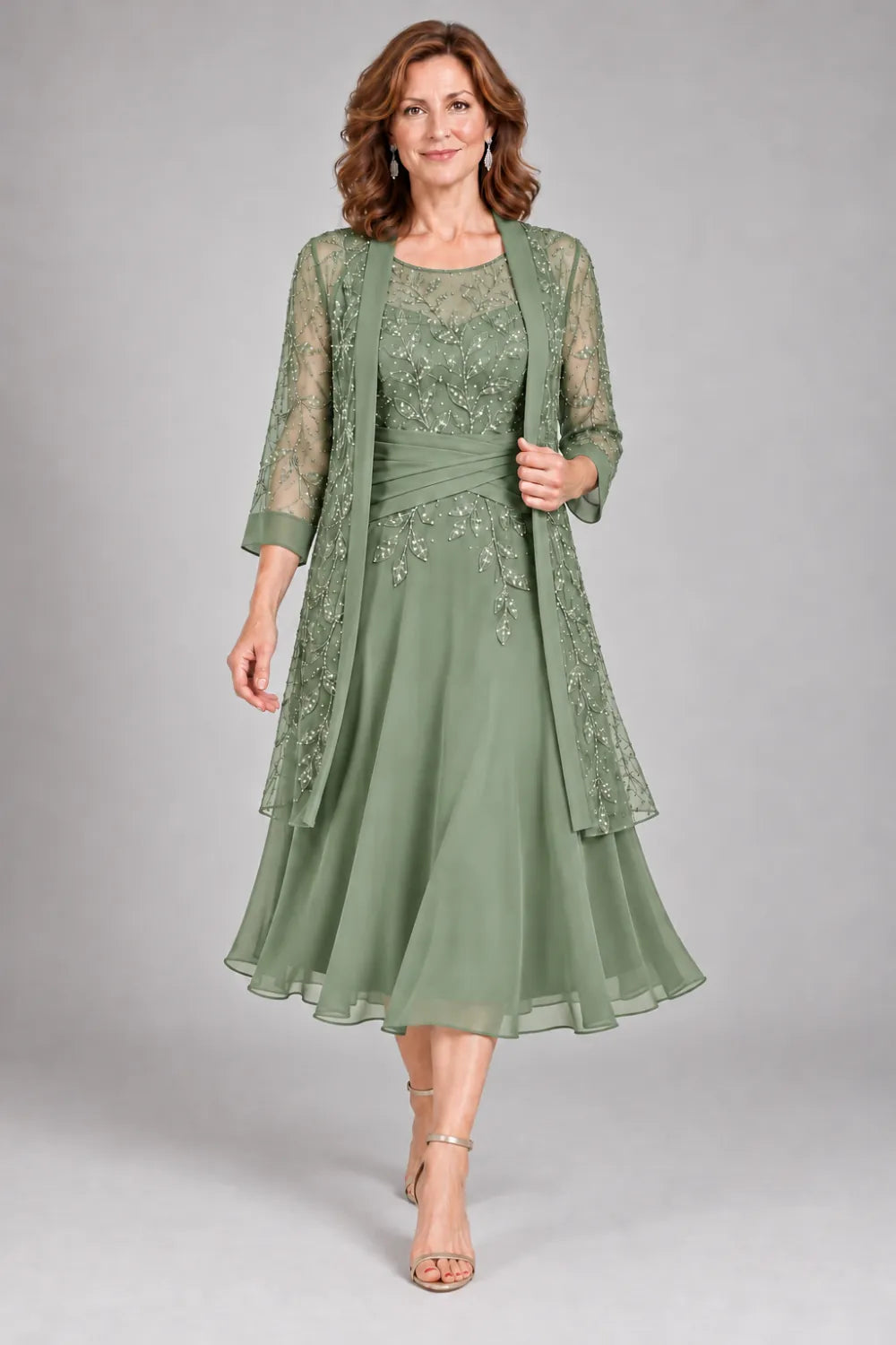 Sage Green dress with floral lace extending below the waist, front view.