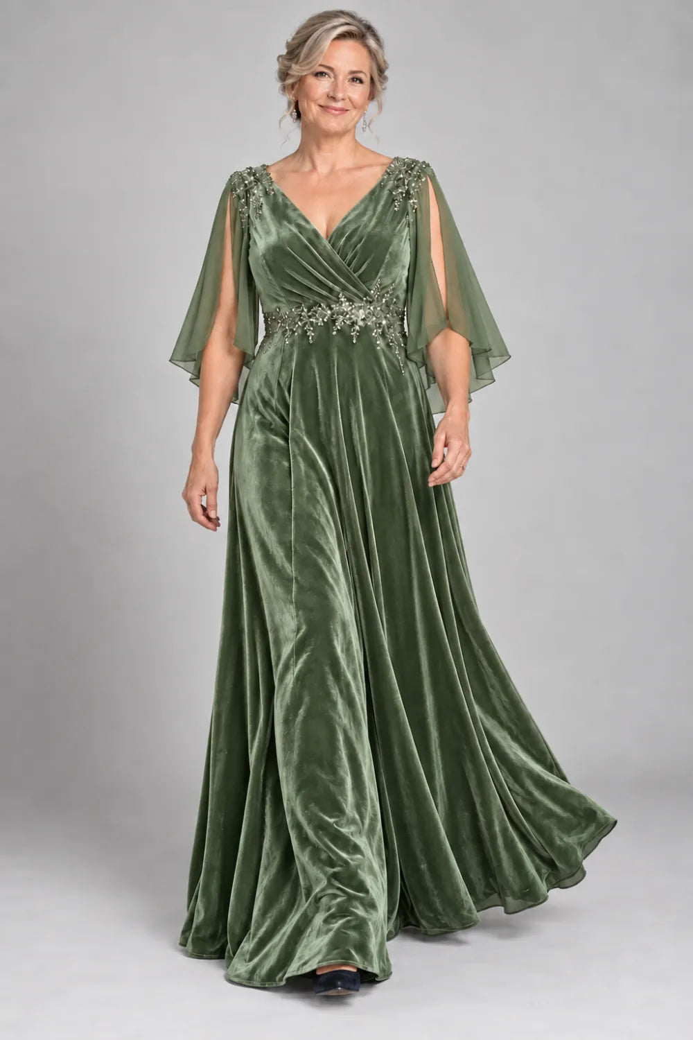Sage Green dress with crossover bodice and decorated waist, front view.