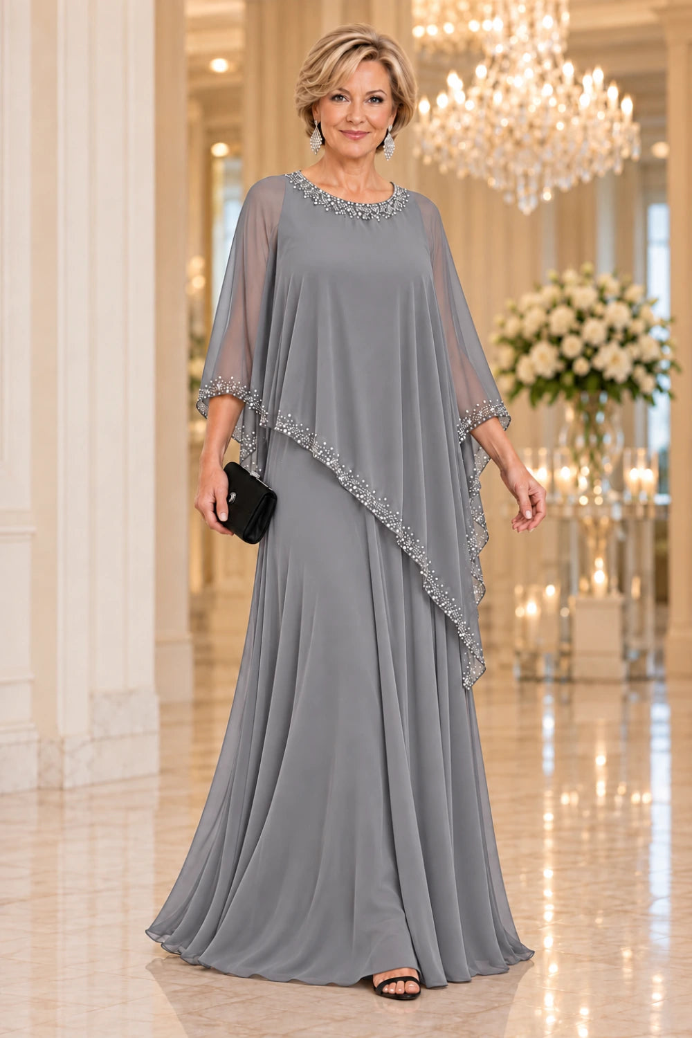 Silver gray gown with a long sheer cape point and bright neckline trim, front view.
