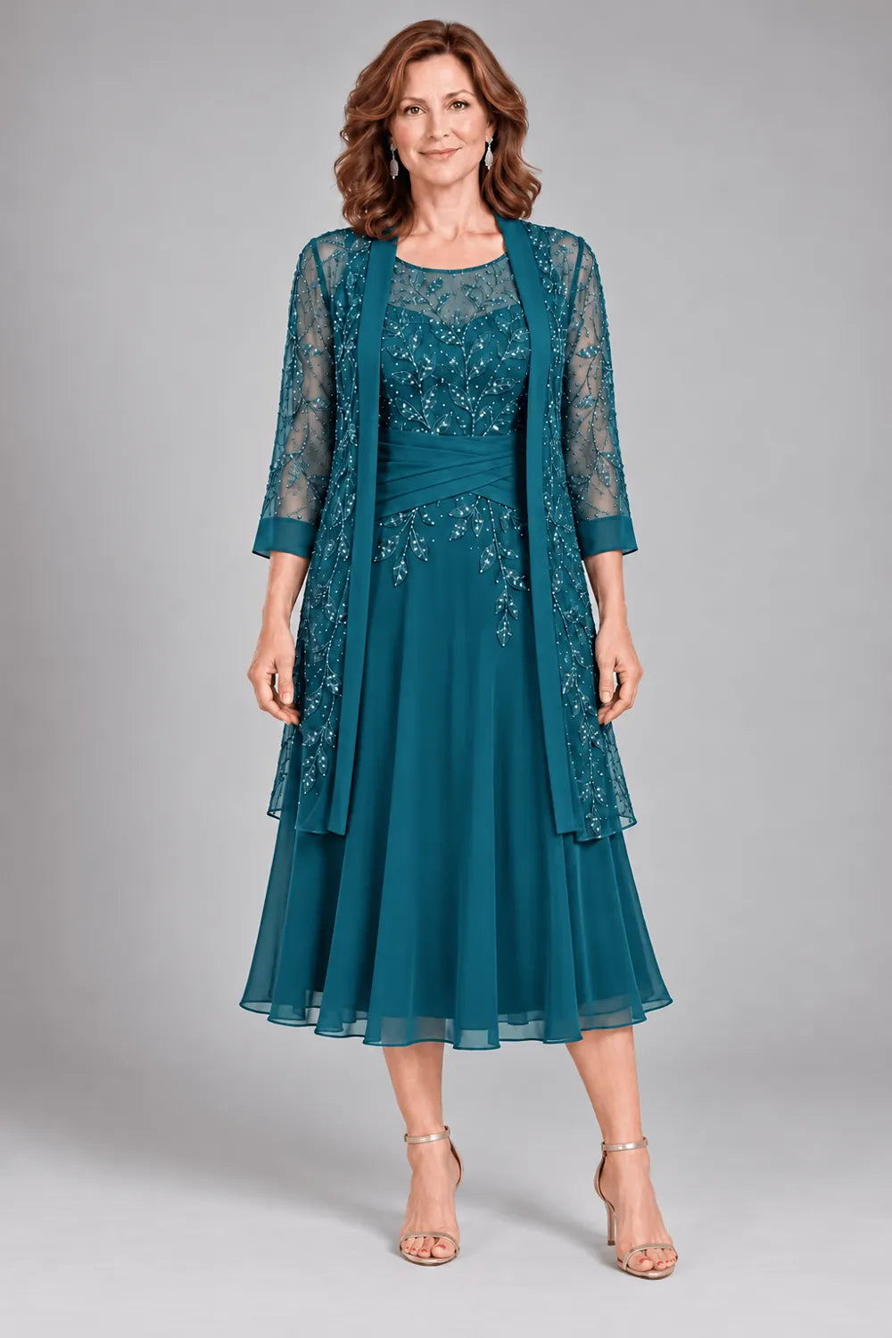 Teal dress with floral lace extending below the waist, front view.