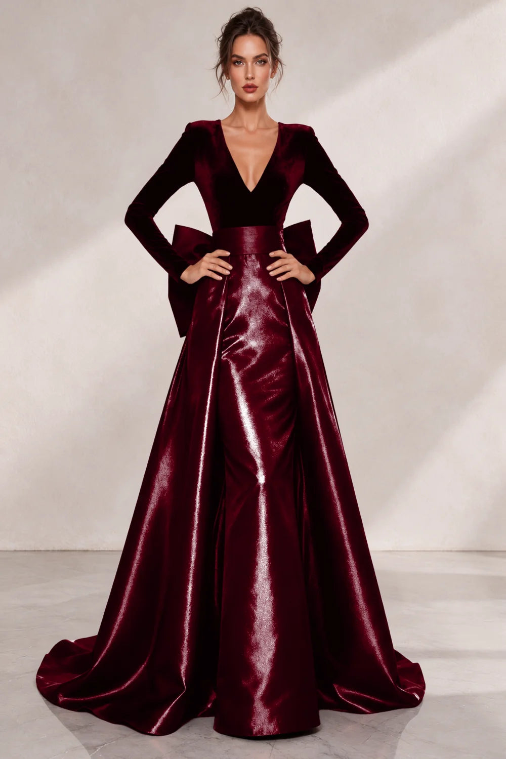 Front view of a wine red dress with a V neckline and a lustrous full skirt.