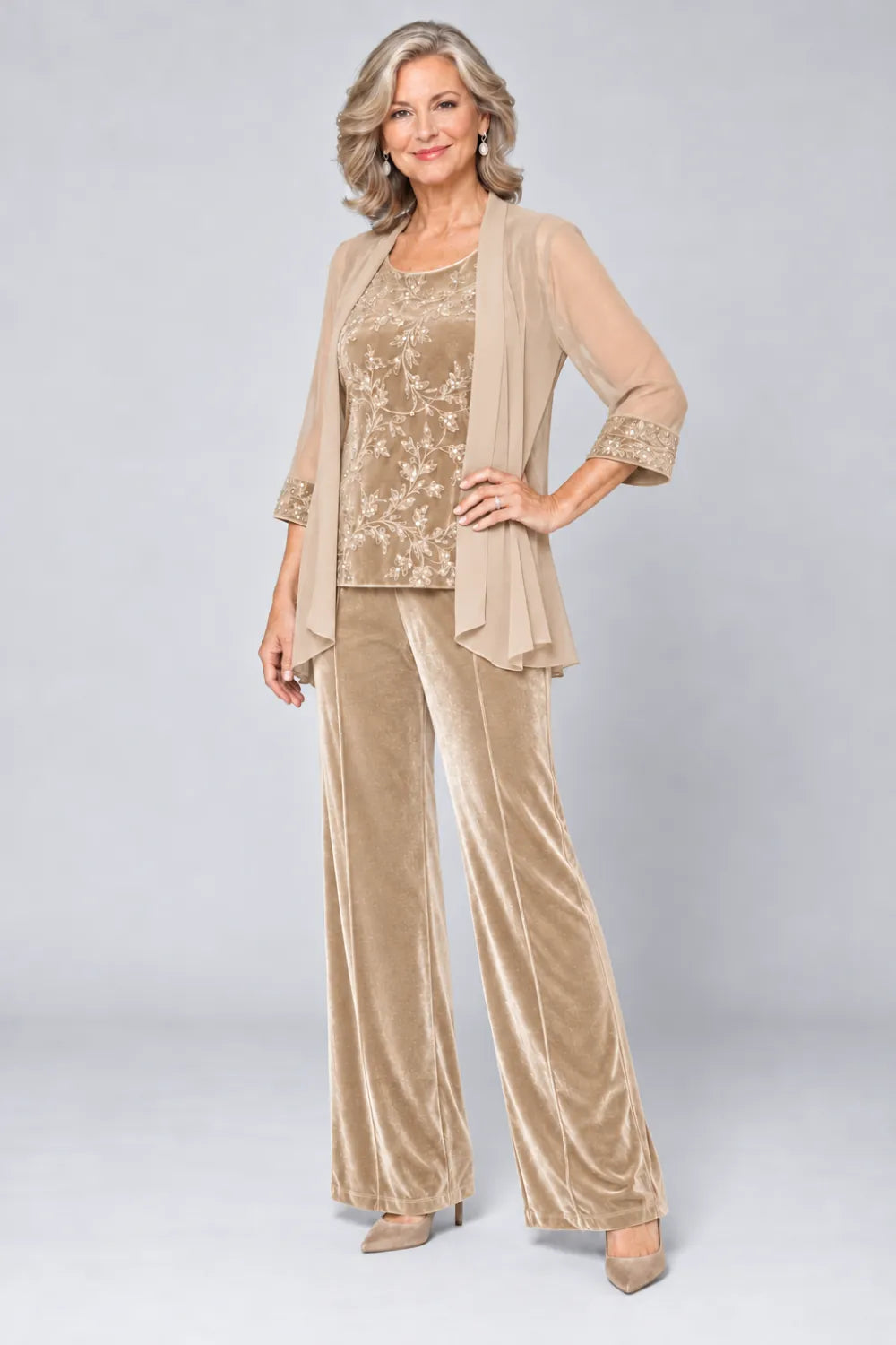 Champagne pant suit with tonal floral top and matching cuff panels, front view.