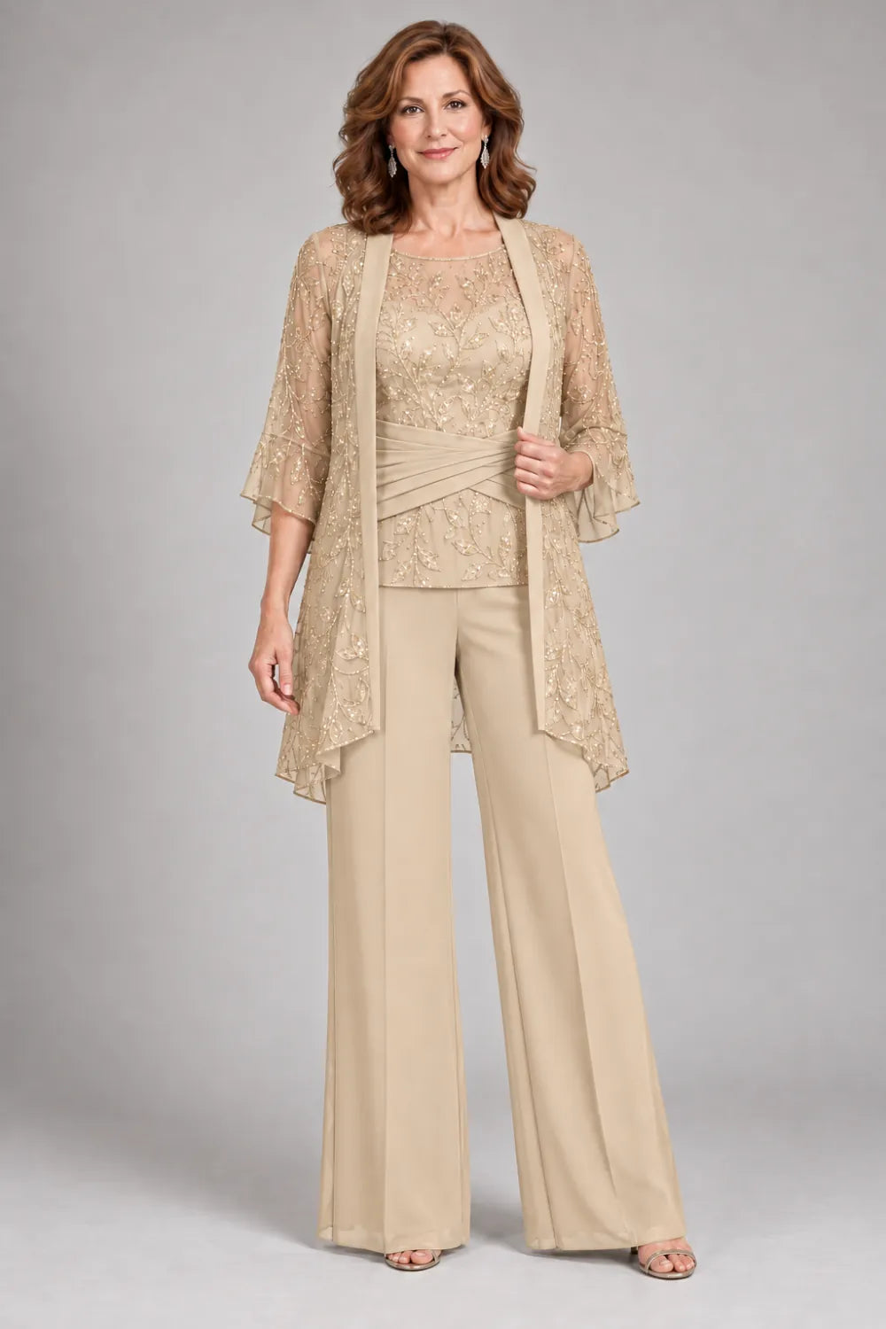 Champagne pant suit with floral lace top and diagonal gathered waist, front view.