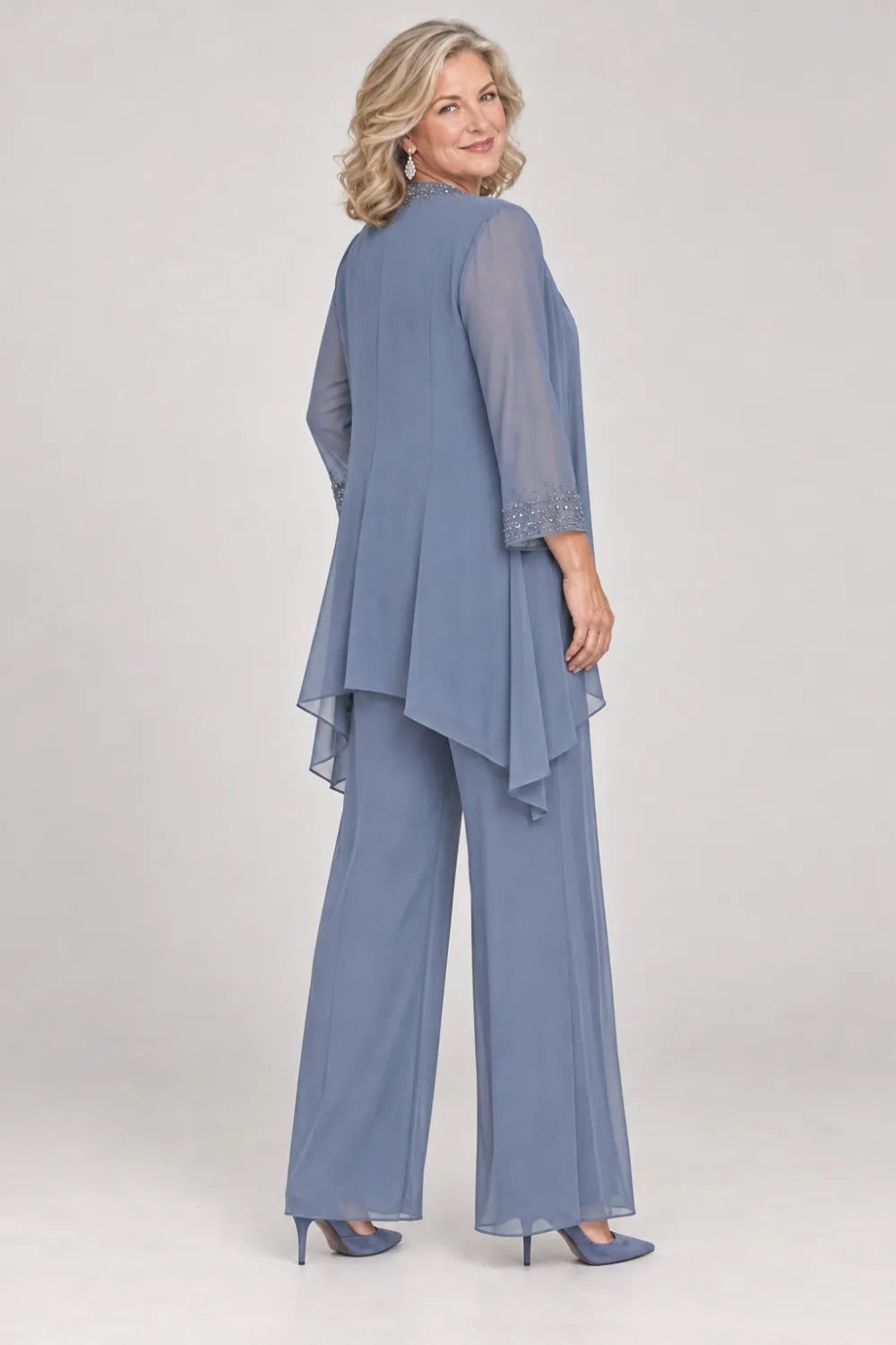 Back view of a dusty blue wide-leg pant suit with sheer waterfall-front jacket.