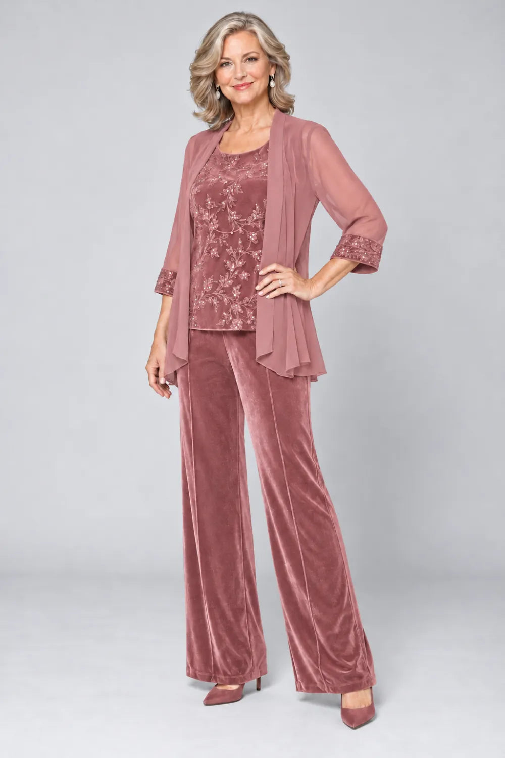 Dusty Rose pant suit with tonal floral top and matching cuff panels, front view.