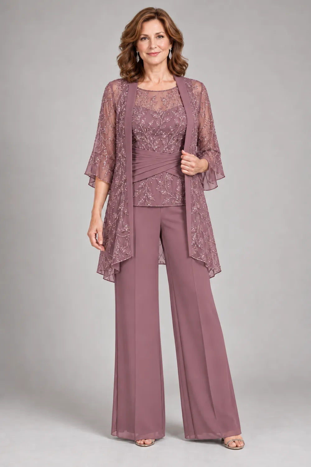 Mauve pant suit with floral lace top and diagonal gathered waist, front view.