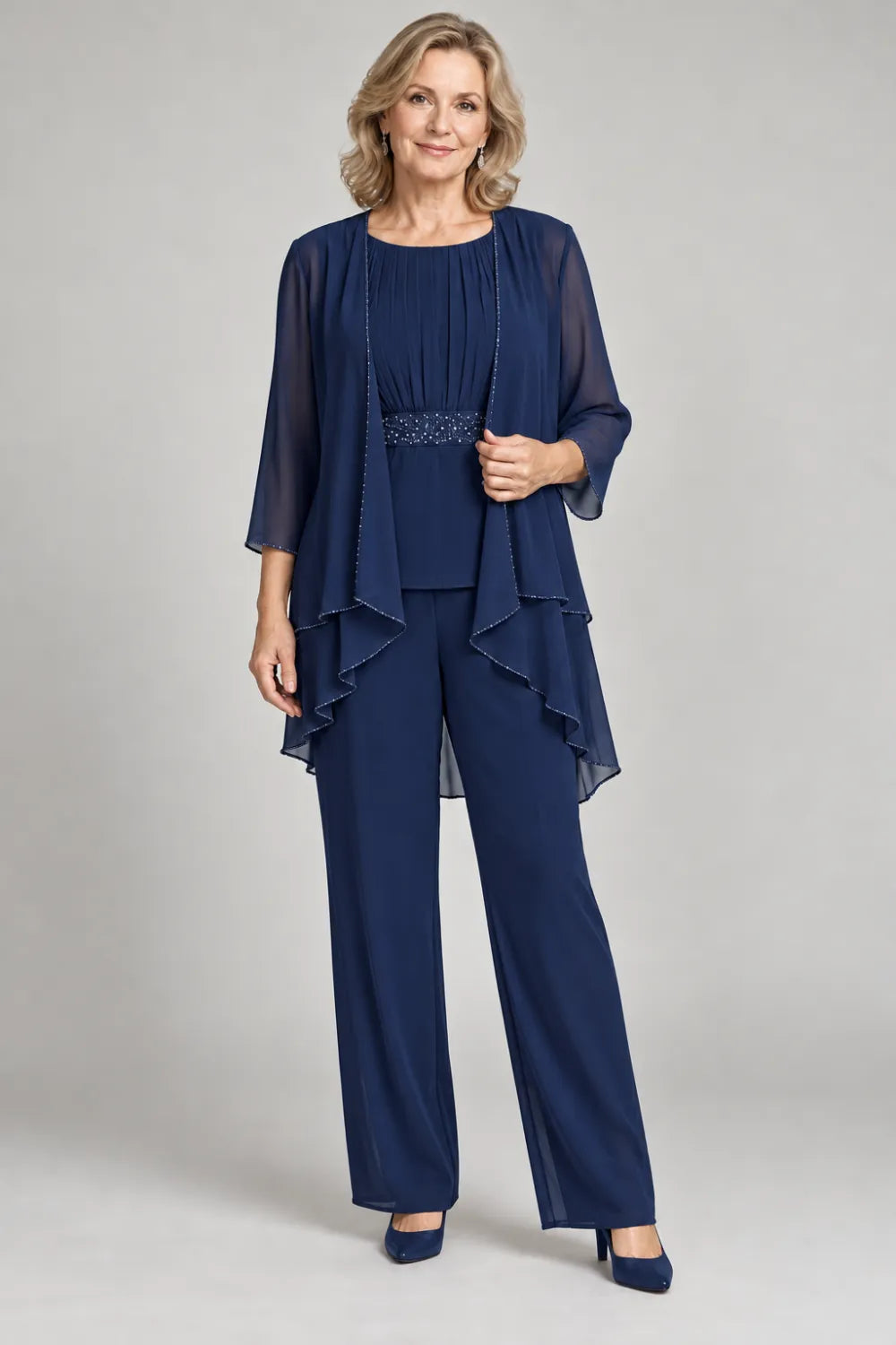 Navy Blue pant suit with gathered top and decorated horizontal waist band, front view.