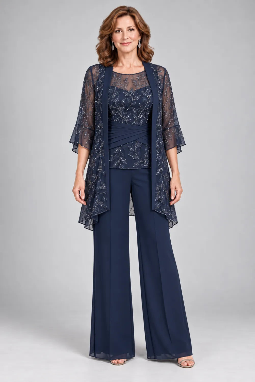 Navy Blue pant suit with floral lace top and diagonal gathered waist, front view.