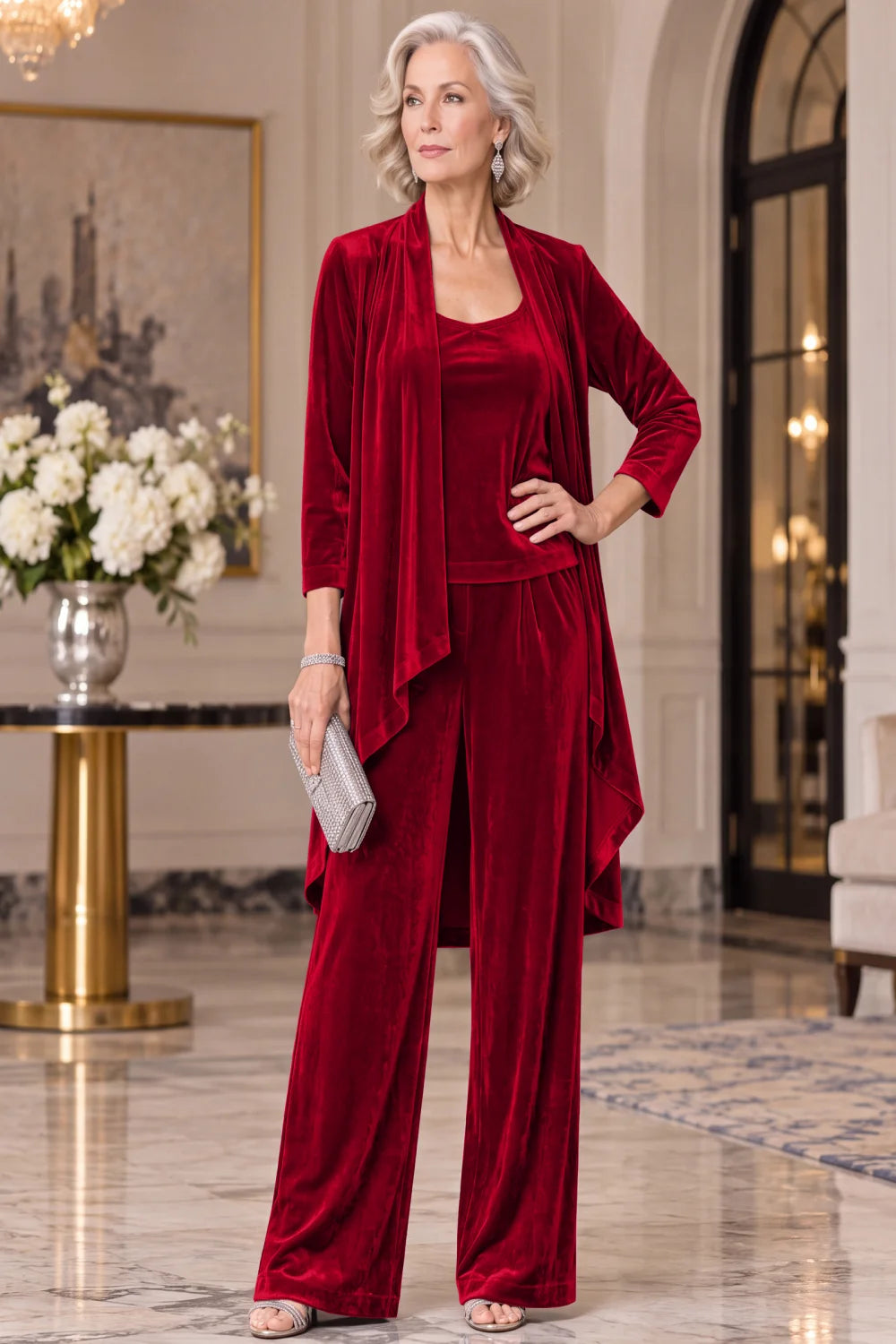 Front view of a red pant suit with a long waterfall jacket and wide-leg trousers.