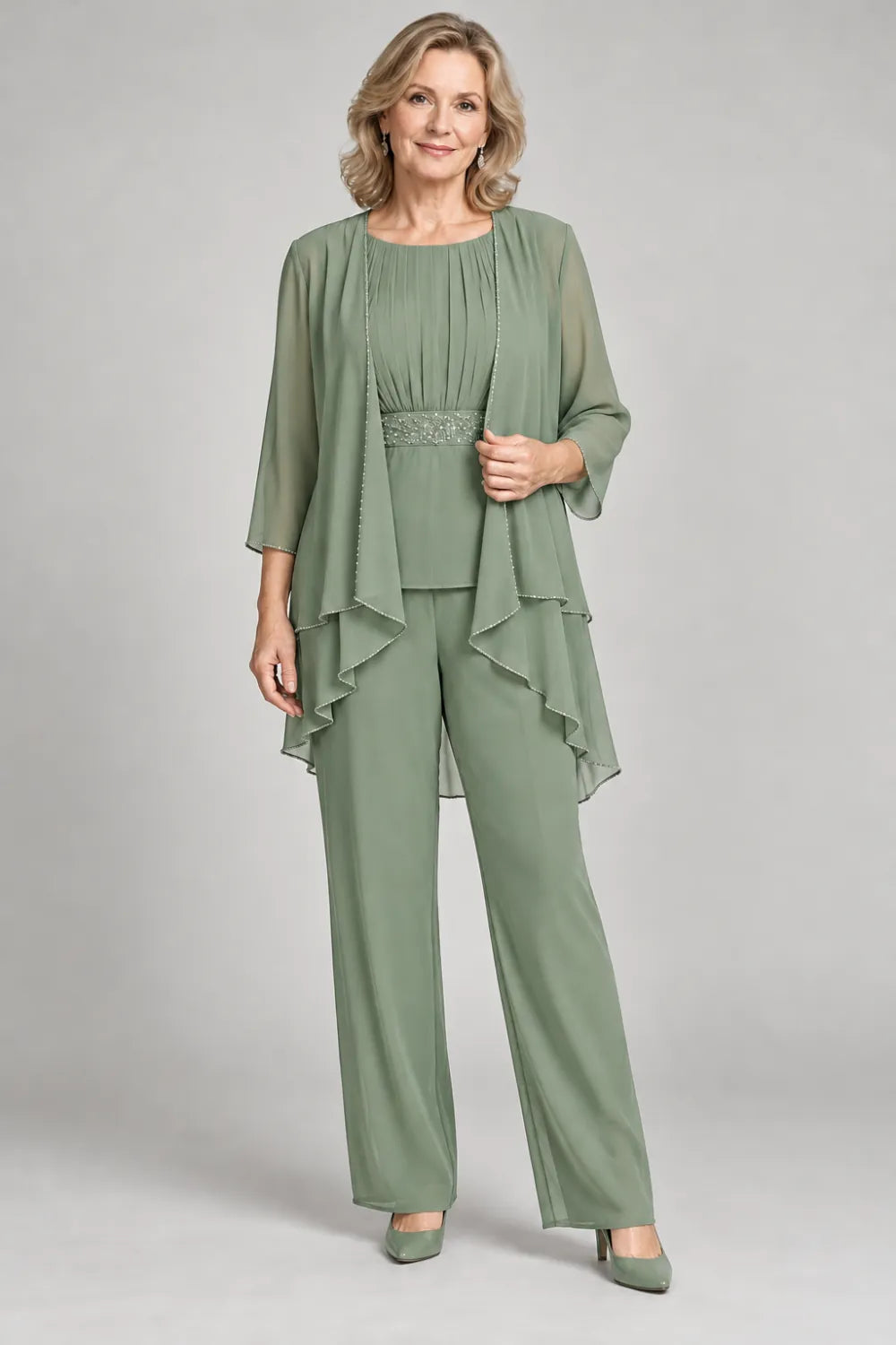 Sage Green pant suit with gathered top and decorated horizontal waist band, front view.