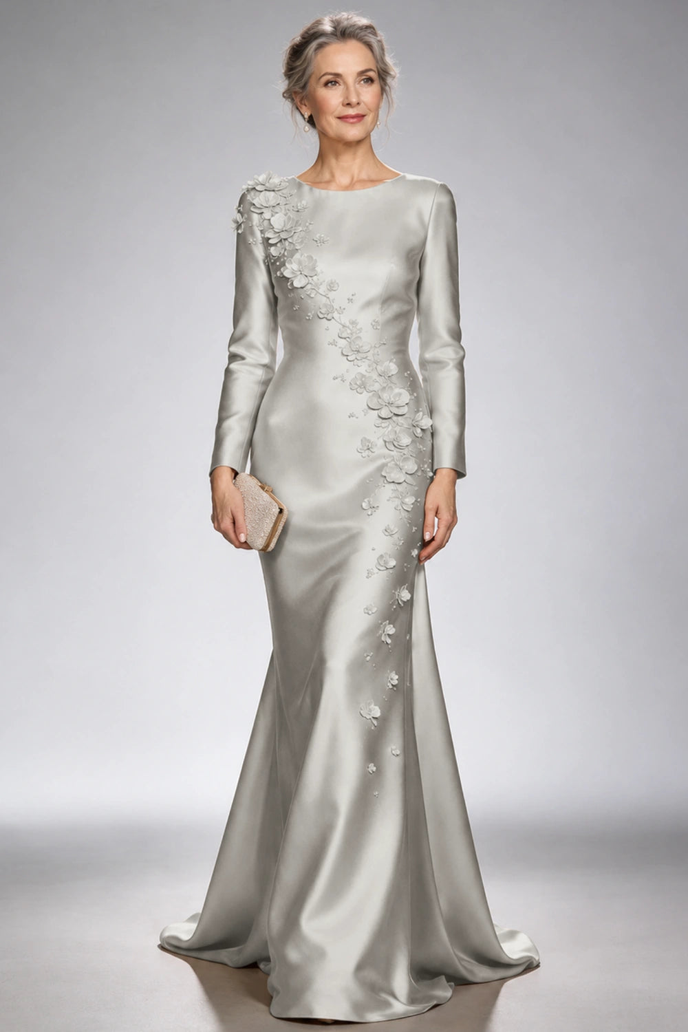Front view of the silver gray satin mermaid dress with long sleeves and diagonal floral appliques across the bodice and skirt.